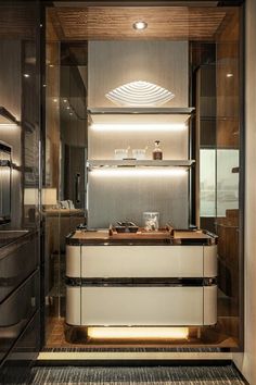 a modern kitchen with stainless steel and wood accents