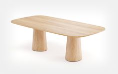 a wooden table sitting on top of a white floor