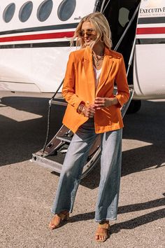 Make the city streets your runway in this vibrant orange blazer featuring lightweight material, a two button closure front, a collared neckline, long loose sleeves, low accent pockets, and a flattering silhouette that ends in a straight hemline! on products Measurements XS : Bust 36", Hip 40", Length 27", Sleeve Length 22", Waist 36". S : Bust 38", Hip 42", Length 27", Sleeve Length 22.5", Waist 38". M : Bust 40", Hip 44", Length 27.5", Sleeve Length 23.5", Waist 40". L : Bust 44", Hip 46", Length 28", Sleeve Length 24", Waist 44". Orange Blazer Outfits, Outfit Work, Color Party, Blazer Outfit, Loose Sleeves, Girls Style, Blazer Outfits