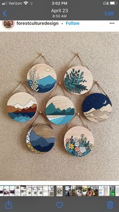 six wooden magnets with different designs on them