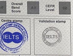 a close up of an electronic stamp on a sheet of paper with the letters ielts and cer