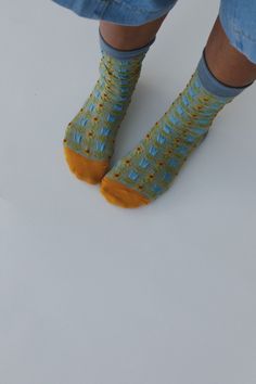 Keep your feet cozy and boho-chic in our Sunny Bloom Socks, these will add such a cute boho touch to your cold weather looks and get so many compliments! So cozy, medium-weight, fabric with so cute floral mix print Beautiful multi-color yarn throughout Perfect for everyday wear for warmth and boho style Pair with: Eye Of The Sun Padded Bralette, Ethereal Shine Stacked Bracelet and Washed Ashore Ruffled Maxi Skirt and Shoreline Platform Sandals. *Due to lighting and differences in monitors, actua Playful Cotton Socks For Summer, Ruffled Maxi Skirt, Boho Socks, Fun Multicolor Summer Socks, Casual Multicolor One-size Socks, Boho Essentials, Playful Multicolor Cotton Socks, Washed Ashore, Bralette Outfit