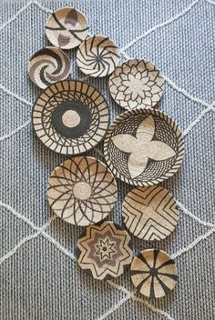 several wooden buttons sitting on top of a rug