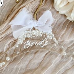 a bridal hair comb with pearls and bows on it's headpieces