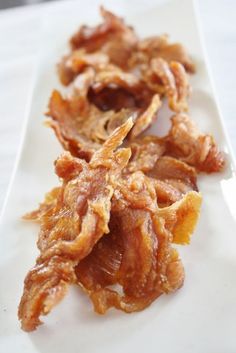 three pieces of food sitting on top of a white plate