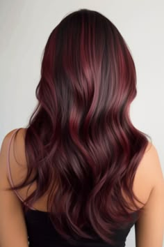 Experience a combination of rich burgundy red and mahogany hues with this fusion style. This hair color is a blend for women who desire a sophisticated yet balanced balayage. Click here to check out more stunning burgundy balayage hair ideas trending right now. Dark Red Hair Extensions, Mahogany And Black Hair, Dark Brown Hair With Burgundy Balayage, Red Wine Balayage Hair, Bargandi Hairs, Burgundy Bayalage Hair Dark, Mahogany Hair Color Burgundy, Red Bolyoge, Dimensional Burgundy Hair