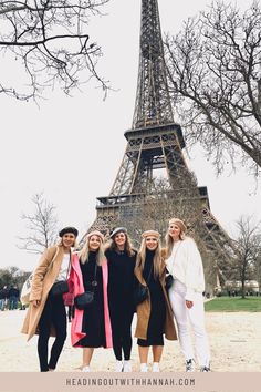 four women standing in front of the eiffel tower with text overlay that reads reading