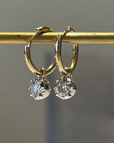 "Lower prices on our main website: https://discomarshmallow.myshopify.com/ A pair of beautiful hoop earrings with round shaped moissanites. In Georgian cut-down settings, the round moissanite Hoop earrings are handcrafted in white and yellow gold, on small yellow gold hoops.  Item Details * Made to Order. * Gold Kt: 14K or 18K Solid Gold * Custom Gold Color: Rose Gold, Yellow Gold, White Gold * Cut: Round * Setting Type: Georgian * Ready to Ship in 20-30 business days If you are interested in a