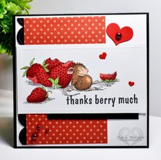 a card with a mouse and strawberries on it