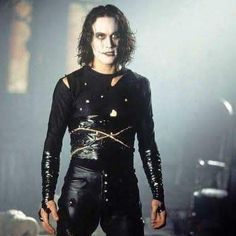 a man with black hair and leather pants