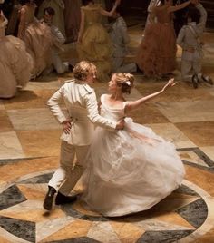 a bride and groom dancing on the dance floor