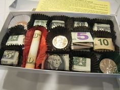 a box filled with lots of money sitting on top of a table