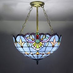 a stained glass chandelier hanging from the ceiling