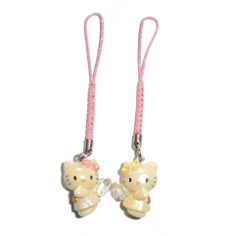 two hello kitty keychains are shown on a white background with pink cords and beads