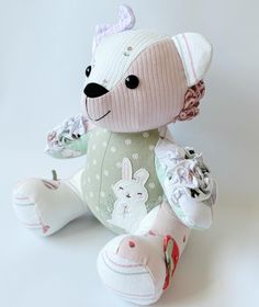 a small stuffed animal sitting on top of a white table