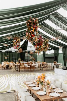 a large tent with tables and chairs set up for an event