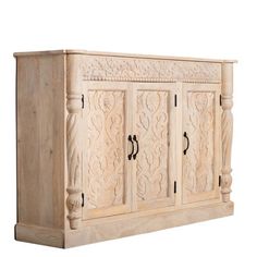 an old wooden cabinet with carvings on the doors and drawer handles, isolated against a white background