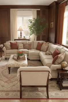 a living room filled with lots of furniture and pillows on top of it's couches