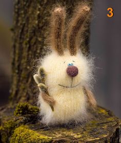 a stuffed animal sitting on top of a tree stump