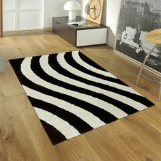 a black and white area rug in a living room