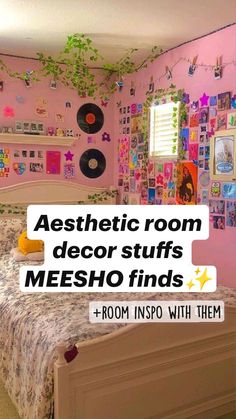 a bedroom with pink walls and pictures on the wall