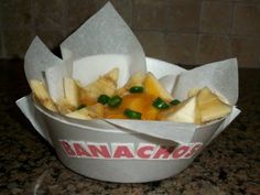 a bowl filled with food sitting on top of a counter