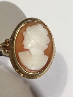 "This is a beautiful condition vintage 14kt yellow gold genuine hand carved shell cameo. Slightly worn but profile and features are very well defined in this classic face. Beautiful beaded bezel holds this cameo in place and the setting and fine detail on shank of ring are stunning. Cameo measures approximately 1/2\" wide and 5/8th \" long. Size 6. Shank is sturdy and this ring will last for generations to come. A true timeless classic. Inside is hallmarked(unreadable) and 14kt is stamped in it. Gold Cameo Signet Ring Collectible, Gold Signet Ring With Cameo Collectible, Vintage Gold Cameo Ring, Vintage Cameo Signet Ring For Anniversary, Cameo 14k Gold Rings For Collectors, Collectible 14k Gold Cameo Rings, Vintage 14k Gold Cameo Rings, Gold Cameo Rings For Anniversary, 14k Gold Cameo Rings For Collectors