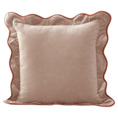 a beige pillow with an orange trim on the front and back of it's sides