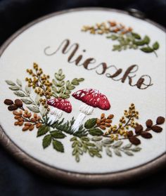 a close up of a embroidery on a piece of cloth with the words niske