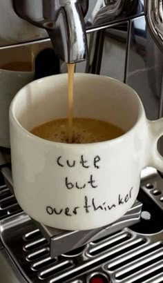 coffee being poured into a cup with the words cutp but overthiker written on it