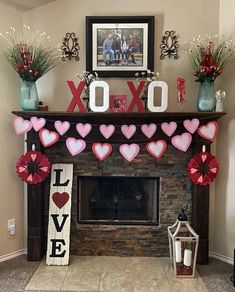 a fireplace decorated with valentine's day decorations