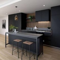 a kitchen with two stools next to an island in the middle of the room