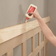 a woman is using a cell phone to check the temperature on her bed headboard