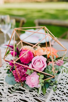 a vase filled with flowers sitting on top of a table