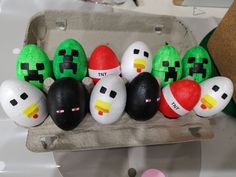 an egg carton filled with different types of painted eggs in the shape of angry birds