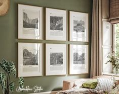 a living room with green walls and pictures on the wall above the couch, along with a wicker coffee table