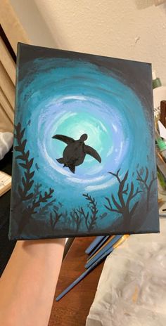 a painting of a turtle swimming in the ocean