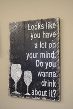 two wooden signs that say, looks like you have a lot on your mind do you wanna drink about it?