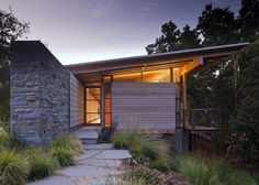 an exterior view of a modern home at dusk