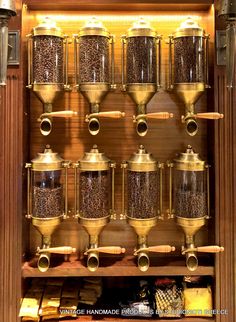 a shelf filled with lots of gold cups