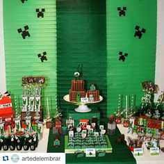 a table topped with cakes and desserts on top of a green carpeted floor