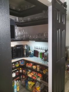 an open pantry with lots of food and drinks