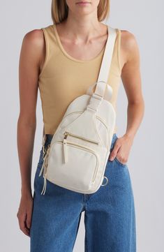 This compact bag with multiple pockets for optimal organization can be easily slung over your shoulder or worn crossbody. Top zip-around closure Adjustable strap Two exterior zip pockets; slip pocket with buckle closure Interior zip pocket Lined Nylon Imported Compact Bag, Concert Looks, Flip Flop Slippers, Sports Blazer, Madden Girl, Suit Shop, Jogger Sweatpants, Casual Streetwear, Summer Essentials