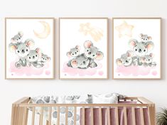 two pictures of koalas in the sky with stars and clouds above them are hanging on a wall next to a crib