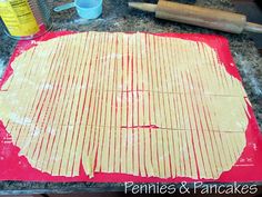 the dough is ready to be baked on the counter top with rolling pincers