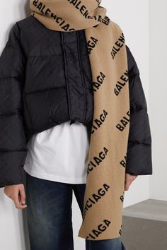 Balenciaga's logo-jacquard scarf is reworked for the season in neutral beige and black hues. Made from soft and cozy wool, it can be wrapped twice around your neck or draped around your shoulders. Luxury Beige Scarf For Fall, Luxury Brown Scarves For Winter, Luxury Monogram Printed Outerwear For Winter, Luxury Monogram Print Outerwear For Winter, Luxury Winter Outerwear With Monogram Print, Luxury Monogram Print Winter Outerwear, Luxury Winter Scarves, Givenchy Scarf, Pink Balenciaga