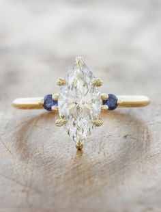 caption:1.40ct marquise diamond Engagement Ring With Hidden Halo, Sapphire Side Stones, Peach Sapphire, Lab Diamond Engagement Ring, Marquise Cut Diamond, Three Stone Engagement, Yellow Gold Setting, Three Stone Engagement Rings, Hidden Halo