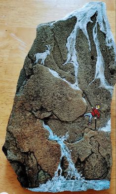 a rock that has some kind of artwork on it