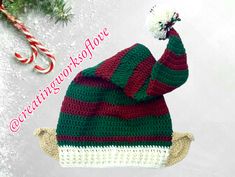 a crocheted christmas ornament with a red and green hat on it