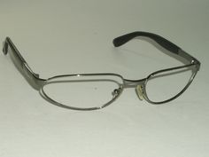 You are bidding on used, stunning looking pair of RAY-BAN RB3107 ??? PYTHON GUNMETAL SPORT WRAP EYEGLASS/SUNGLASSES FRAMES ONLY. NOT SURE ABOUT EXACT MODEL NUMBER AS INFORMATION WRITTEN ON TEMPLES HAS BEEN RUBBED OFF DUE TO USAGE. FRAME IS OVERALL VERY GOOD CONDITION. THE LENS SIZE SHAPE APPEARS TO BE SAME AS OF RAY BAN RB3107 MODEL. Measures 5 1/4" across/wide maximum, actual distance b/w the hinges is 5 1/8" & length of temple arm is 4 3/8" & overall vertical height is slightly over 1 1/4". Pl Alt Glasses Frames, Men Glasses Style, 2000s Glasses, Blank Stare, Sport Glasses, Inside My Bag, Cute Glasses, Sports Glasses, Casual School Outfits